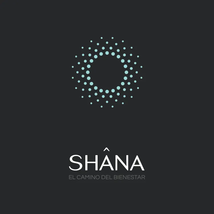 Shâna logo lockup with the breathing symbol over the wordmark