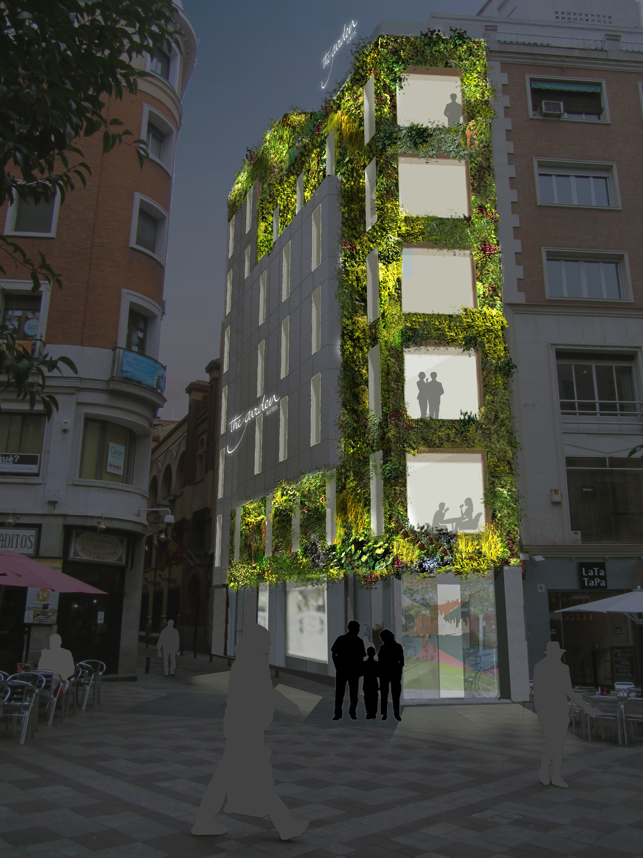 The Garden Suites illuminated at night — living green wall reflected in the pedestrian street